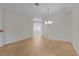Bright living room featuring hardwood floors and chandelier at 2124 Hames Ln, The Villages, FL 32162