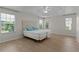 Bright main bedroom featuring tray ceilings and lots of natural light at 2124 Hames Ln, The Villages, FL 32162