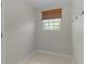 Office space with tiled floor, one window and a woven shade at 2124 Hames Ln, The Villages, FL 32162
