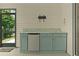 Screened porch kitchenette featuring ample counter space, storage cabinets, and mini fridge at 2124 Hames Ln, The Villages, FL 32162