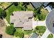 Aerial view of home showcasing the roof, landscaping, driveway and a partial view of a swimming pool at 2237 Avon Loop, The Villages, FL 32162