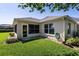 The house has a lush backyard with well-maintained lawn and minimal landscaping at 2237 Avon Loop, The Villages, FL 32162