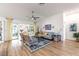 Bright living room with vaulted ceilings, sliding glass doors to the patio, and comfortable seating at 2237 Avon Loop, The Villages, FL 32162