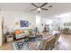 Inviting living room with vaulted ceilings, stylish decor, and seamless flow to other areas at 2237 Avon Loop, The Villages, FL 32162