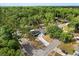 Overhead view of the home highlighting landscaping, driveway and a backdrop of lush greenery at 227 Oak Rd, Winter Springs, FL 32708