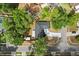 Birds eye view of the roof, back yard, trees, and driveway at 227 Oak Rd, Winter Springs, FL 32708