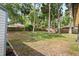 Expansive back yard featuring green grass, trees, and a wood fence at 227 Oak Rd, Winter Springs, FL 32708