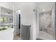Bathroom with a walk-in shower featuring marble-look tile and glass enclosure at 227 Oak Rd, Winter Springs, FL 32708