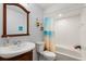 Bathroom with single sink vanity, a standard toilet and a tub with a shower at 227 Oak Rd, Winter Springs, FL 32708