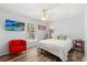 A bedroom with natural light, a window view, and a modern accent chair at 227 Oak Rd, Winter Springs, FL 32708