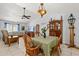 Cozy dining area with a unique light fixture and furniture, adjacent to the living room at 227 Oak Rd, Winter Springs, FL 32708