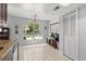 Bright kitchen nook area with large window and tile flooring near an appliance closet at 227 Oak Rd, Winter Springs, FL 32708
