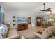 Spacious living room featuring tile flooring, neutral colors, and an adjacent dining area at 227 Oak Rd, Winter Springs, FL 32708