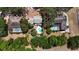 Aerial view of the property nestled among lush trees in a private neighborhood at 26 Weston Rd, Leesburg, FL 34748