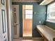 Bathroom with a framed shower, window, and vanity with bright lighting at 26 Weston Rd, Leesburg, FL 34748