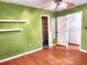 Bedroom with hardwood floors, shelves, and closet at 26 Weston Rd, Leesburg, FL 34748