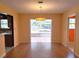 Dining room features an open floor plan with a sliding door leading to the lanai at 26 Weston Rd, Leesburg, FL 34748