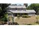 Inviting two-story home with a covered porch and well-manicured landscaping at 26 Weston Rd, Leesburg, FL 34748