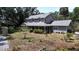 Traditional two-story home with a covered front porch provides great curb appeal at 26 Weston Rd, Leesburg, FL 34748