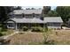 Charming two-story home with a classic covered porch offers curb appeal at 26 Weston Rd, Leesburg, FL 34748