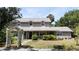 Charming two-story home with dormer windows and a welcoming front porch at 26 Weston Rd, Leesburg, FL 34748