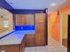 Kitchen with blue under-cabinet lighting and breakfast bar at 26 Weston Rd, Leesburg, FL 34748