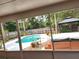 View from lanai of backyard, pool and gazebo sitting on large lot at 26 Weston Rd, Leesburg, FL 34748