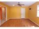 Bright living room features wood floors, ceiling fan, and a neutral color scheme at 26 Weston Rd, Leesburg, FL 34748