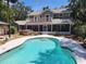 A beautiful backyard pool with a spa, gazebo and screened-in porch offer outdoor living at its finest at 26 Weston Rd, Leesburg, FL 34748