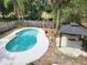 Aerial view of private backyard with in-ground pool, gazebo, and lush landscaping at 26 Weston Rd, Leesburg, FL 34748