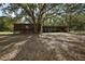 Barn with a horse and open stalls, providing ample space and shelter for animals at 27011 Se Highway 42, Umatilla, FL 32784