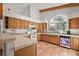 Spacious kitchen featuring abundant counter space, wood cabinets, and tiled floors at 27011 Se Highway 42, Umatilla, FL 32784