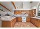 Well-appointed kitchen with ample counter space, wood cabinetry, and tiled floors at 27011 Se Highway 42, Umatilla, FL 32784