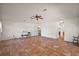 Open living room with terracotta tile and doorway to kitchen at 27011 Se Highway 42, Umatilla, FL 32784