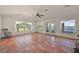 Bright living room with large windows offering beautiful lake views at 27011 Se Highway 42, Umatilla, FL 32784