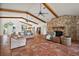 Spacious living area with cozy seating, exposed beams, and lots of natural light at 27011 Se Highway 42, Umatilla, FL 32784