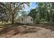 Utility shed in the backyard provides secure storage space for tools and equipment at 27011 Se Highway 42, Umatilla, FL 32784