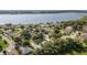 Enjoy a spacious home in a lakeside community with lush trees and community boat docks at 2750 Coral Reef Way, Tavares, FL 32778