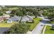 Aerial view of home with mature landscaping and new roof in a quiet neighborhood at 2750 Coral Reef Way, Tavares, FL 32778