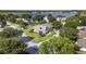 Aerial view of home in a neighborhood near a large lake at 2750 Coral Reef Way, Tavares, FL 32778