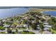 Enjoy a spacious home in a lakeside community with lush trees and community boat docks at 2750 Coral Reef Way, Tavares, FL 32778