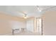 Neutral bedroom featuring tile floors, ceiling fan, and closet at 2750 Coral Reef Way, Tavares, FL 32778