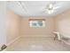Neutral bedroom featuring tile floors, ceiling fan, and track lighting at 2750 Coral Reef Way, Tavares, FL 32778