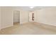Cozy bedroom featuring neutral walls, carpet flooring, ceiling fan, and a closet for storage at 2750 Coral Reef Way, Tavares, FL 32778