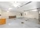 Spacious two car garage with ceiling fans, ample storage, and epoxy flooring at 2750 Coral Reef Way, Tavares, FL 32778