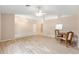 Spacious living room with wood flooring and open layout, perfect for entertaining and comfortable living at 2750 Coral Reef Way, Tavares, FL 32778