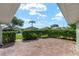Cozy outdoor patio area with a well-maintained hedge, providing a private space at 2750 Coral Reef Way, Tavares, FL 32778