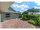 Back patio featuring privacy landscaping at 2750 Coral Reef Way, Tavares, FL 32778