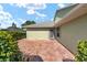 Private back patio area with a textured concrete surface, ideal for outdoor enjoyment at 2750 Coral Reef Way, Tavares, FL 32778