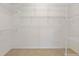 Spacious walk-in closet with wire shelving and neutral carpeting at 2750 Coral Reef Way, Tavares, FL 32778